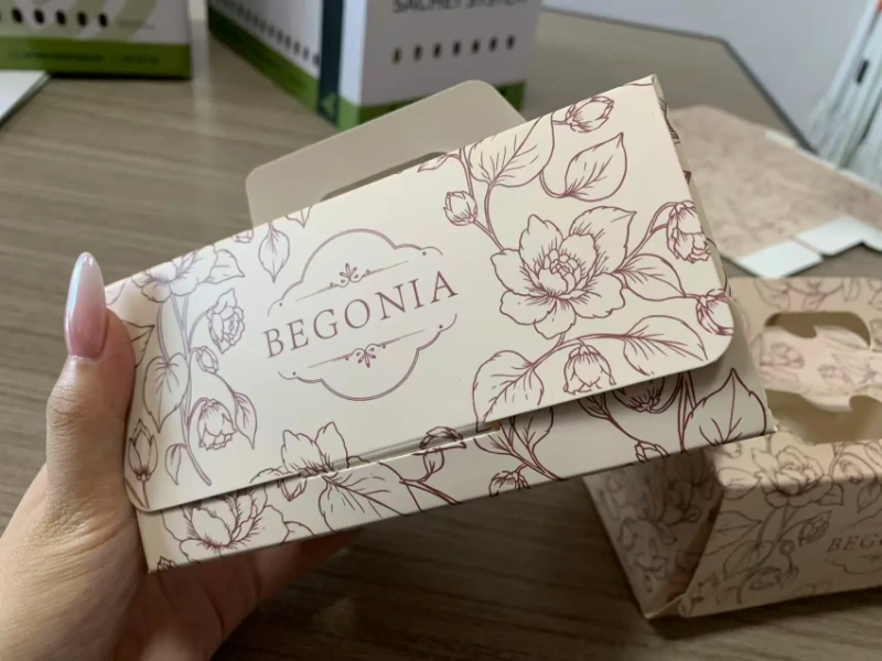 Matte film laminated flower handheld cake box sample with hand drawn floral design